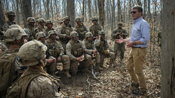 Marines participating in a platoon defense demonstration at Marine Corps Base Quantico, Va., take a break from training to speak with Defense Secretary Ash Carter, March 9, 2016. DoD photo by Air Force Senior Master Sgt. Adrian Cadiz