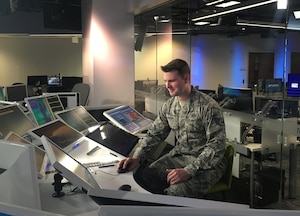 Staff Sgt. Trevor Reiss, a weather forecaster assigned to the 21st Operational Weather Squadron, gets familiar with the technology and computer models used by Weather Channel meteorologists, Feb. 25, at the Weather Channel studio in Atlanta, Ga. Reiss was one of two Airmen from the 557th Weather Wing who was invited to guest star on their show “Weather Geeks,” which will air this Sunday, March 13 at noon, EDT. (U.S. Air Force photo by 1st Lt. Carrie Volpe/Released)