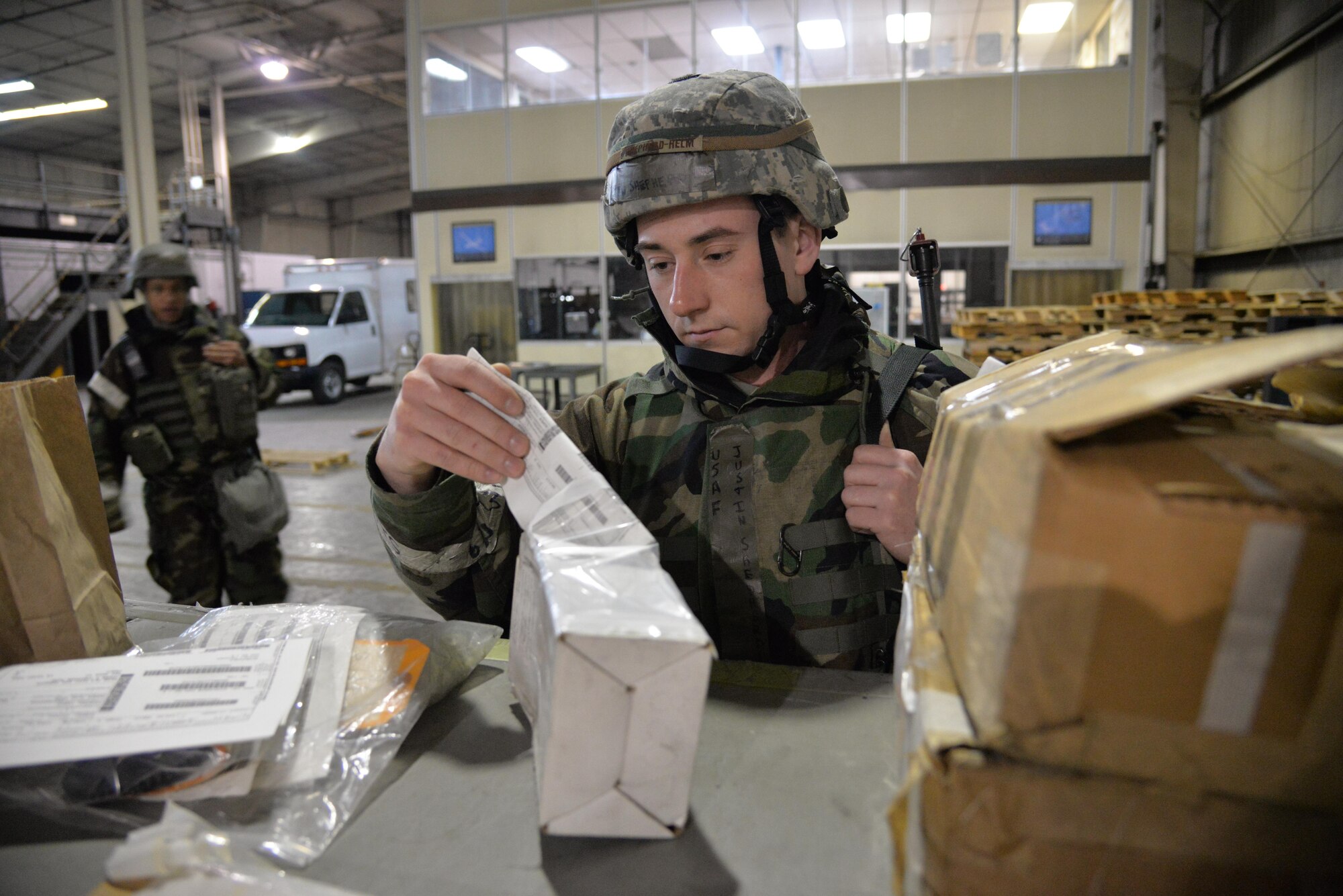 Senior Airman Justin Shepherd-Helm, 51st Logistics Readiness Squadron documented cargo section vehicle operator dispatcher, reviews a shipping document to verify the cargo’s destination during Exercise Beverly Midnight 16-01 at Osan Air Base, Republic of Korea, March 9, 2016. Shepherd-Helm checks specific shipping documents when he has to make a delivery to verify if additional cargo can be dropped off in the same area. BM 16-01 is an exercise designed to test the warfighting capabilities of the units assigned to the 51st Fighter Wing with a focus on readiness, defending the base, executing contingency operations, and sustaining the force.  (U.S. Air Force photo by Tech. Sgt. Travis Edwards/Released)