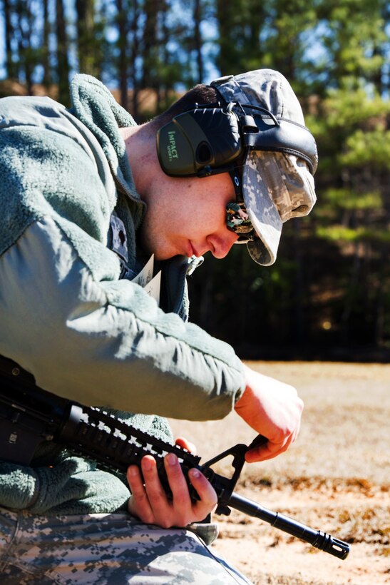 Army Spc. Chris McCart adjusts the sights on a M4 carbine rifle on Fort Jackson, S.C. Feb. 27, 2016. McCart is assigned to the South Carolina Army National Guard’s Headquarters Company, 218th Combined Arms Battalion, and is helping soldiers zero their weapons before they head to the qualification range. South Carolina Air National Guard photo by Tech. Sgt. Jorge Intriago