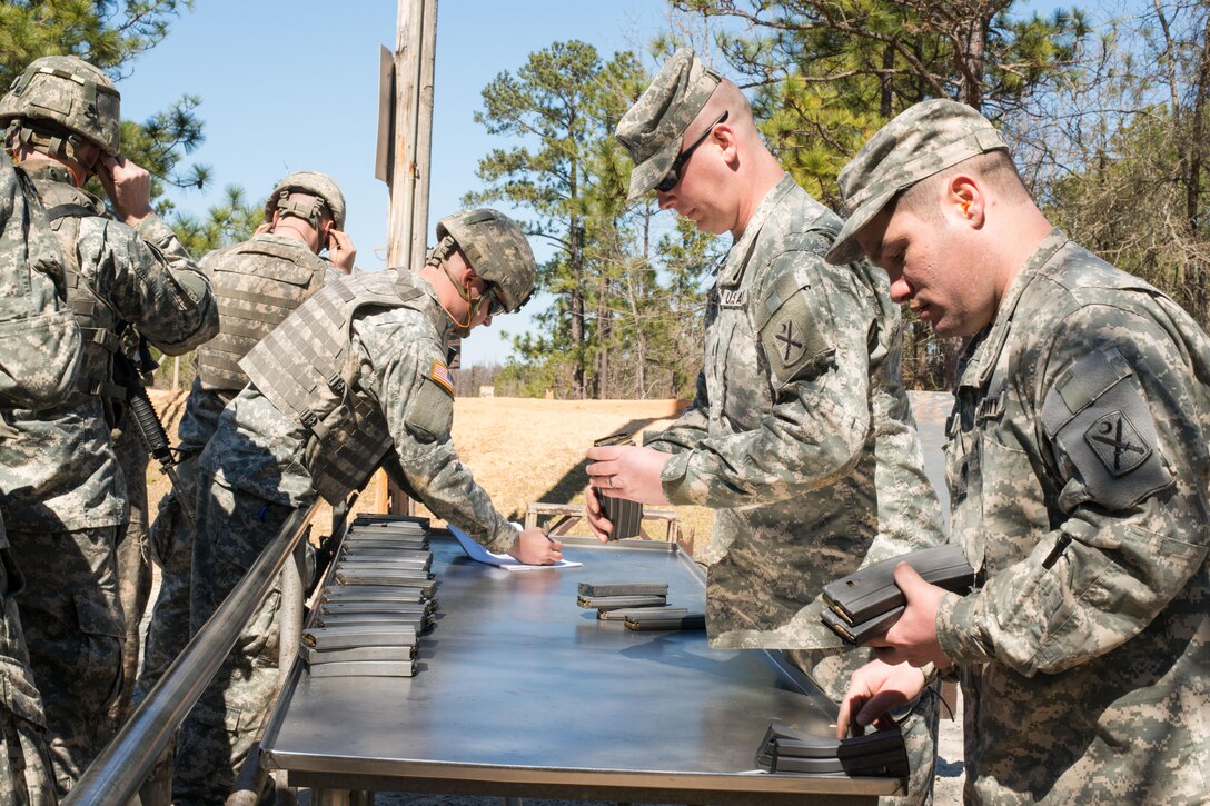Soldiers receive ammunition before walking to the qualification range on Fort Jackson, S.C. Feb. 27, 2016. South Carolina Air National Guard photo by Tech. Sgt. Jorge Intriago
