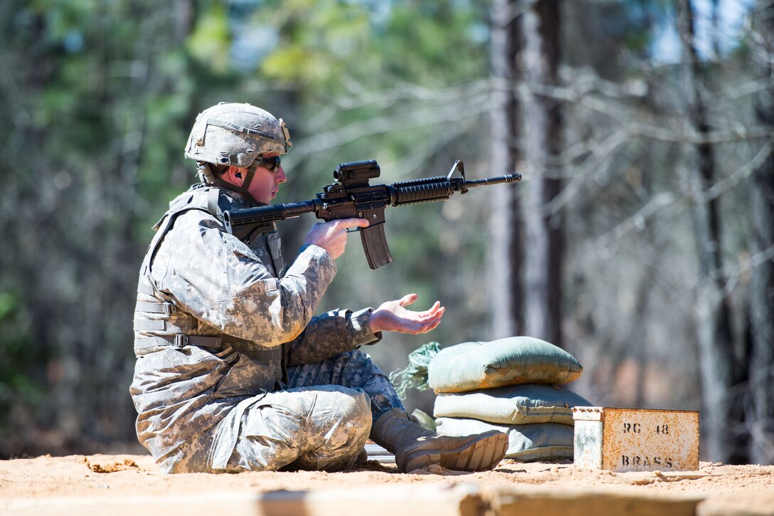 Army Spc. Peter Palmer loads a magazine into his M4 carbine rifle at the qualification range on Fort Jackson, S.C. Feb. 27, 2016. Palmer is a forward observer assigned to the South Carolina Army National Guard’s Headquarters Company, 218th Combined Arms Battalion. South Carolina Air National Guard photo by Tech. Sgt. Jorge Intriago
