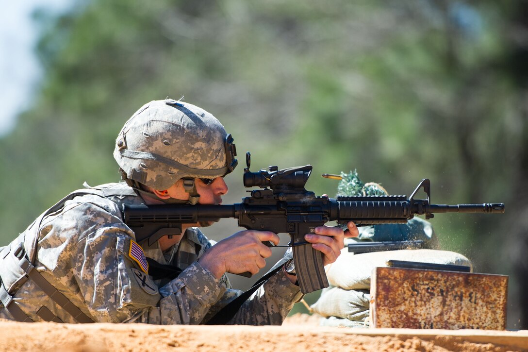Army Sgt. Christopher Lee fires his M4 carbine rifle at the qualification range on Fort Jackson, S.C. Feb. 27, 2016. Lee is an automated logistics specialist assigned to the South Carolina Army National Guard’s Headquarters Company, 218th Combined Arms Battalion. South Carolina Air National Guard photo by Tech. Sgt. Jorge Intriago
