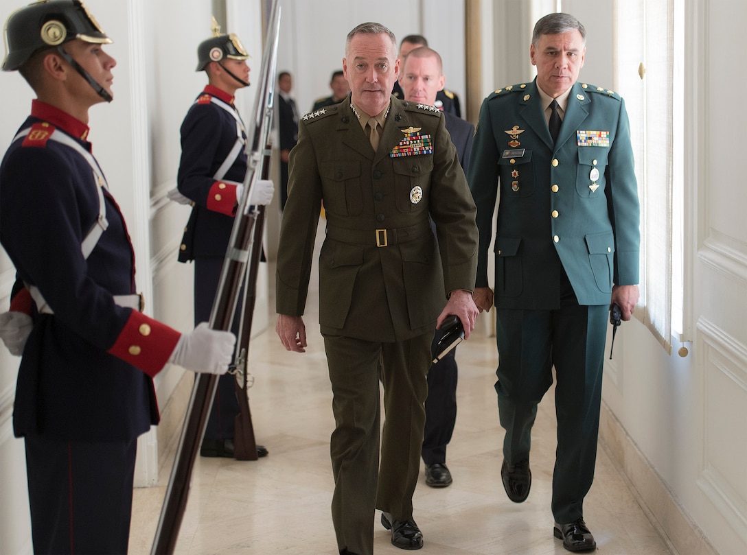 Marine Corps Gen. Joseph F. Dunford Jr., chairman of the Joint Chiefs of Staff, left, passes Colombian guards as he heads to a meeting with Colombian President Juan Manuel Santos at the Palacio de Narino in Bogota, Colombia, March 10, 2016. DoD photo by Navy Petty Officer 2nd Class Dominique A. Pineiro