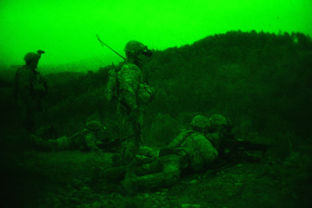 As seen through a night-vision device, paratroopers engage targets during a night live-fire exercise as part of Exercise Rock Sokol at Pocek Range in Postonja, Slovenia, March 9, 2016. Army photo by Paolo Bovo