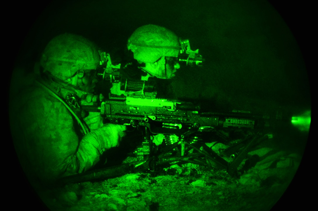 As seen through a night-vision device, paratroopers fire their machine gun at targets during a night live-fire exercise as part of Exercise Rock Sokol at Pocek Range in Postonja, Slovenia, March 9, 2016. Army photo by Paolo Bovo