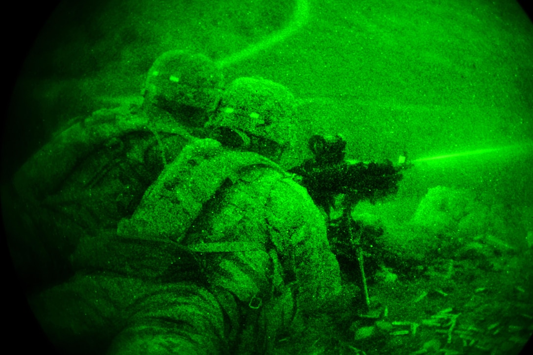 As seen through a night-vision device, paratroopers engage targets during a night live-fire exercise as part of Exercise Rock Sokol at Pocek Range in Postonja, Slovenia, March 9, 2016. Army photo by Paolo Bovo