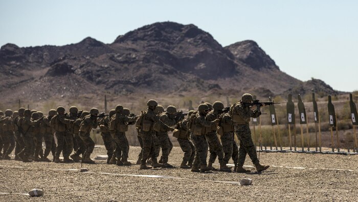 Marines with Marine Wing Support Squadron 371, based out of Marine Corps Air Station Yuma, perform shooting drills with their M16A4 service rifles during a squadron field exercise at the U.S. Army Yuma Proving Ground training facility in Yuma, Ariz., Wednesday, March 9, 2016. The evolution focuses on the basic fundamentals of deployment in an austere environment and a re-familiarization with weapons proficiency. 