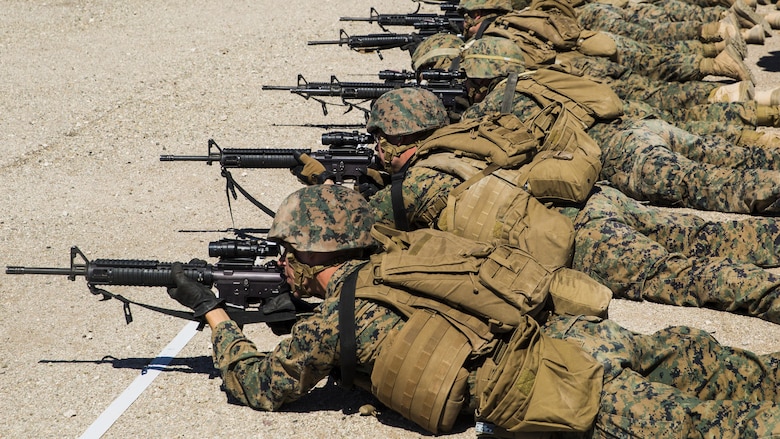 Marines with Marine Wing Support Squadron 371, based out of Marine Corps Air Station Yuma, perform shooting drills with their M16A4 service rifles during a squadron field exercise at the U.S. Army Yuma Proving Ground training facility in Yuma, Ariz., Wednesday, March 9, 2016. The evolution focuses on the basic fundamentals of deployment in an austere environment and a re-familiarization with weapons proficiency. 