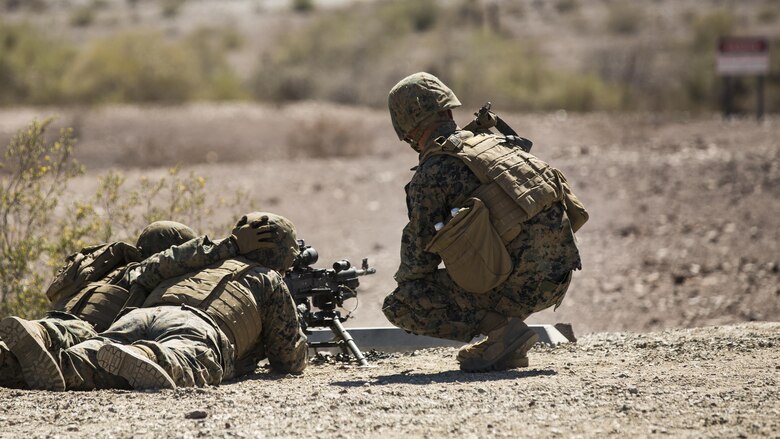 Marines with Marine Wing Support Squadron 371, based out of Marine Corps Air Station Yuma, fire an M249 Squad Automatic Weapon, during a squadron field exercise at the U.S. Army Yuma Proving Ground training facility in Yuma, Ariz., Wednesday, March 9, 2016. The evolution focuses on the basic fundamentals of deployment in an austere environment and a re-familiarization with weapons proficiency. 