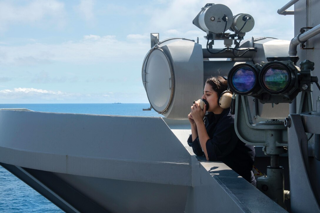 Navy Seaman Destiny Mercado stands lookout aboard the aircraft carrier USS John C. Stennis in the South China Sea, March 6, 2016. Navy photo by Petty Officer 2nd Class Jonathan Jiang