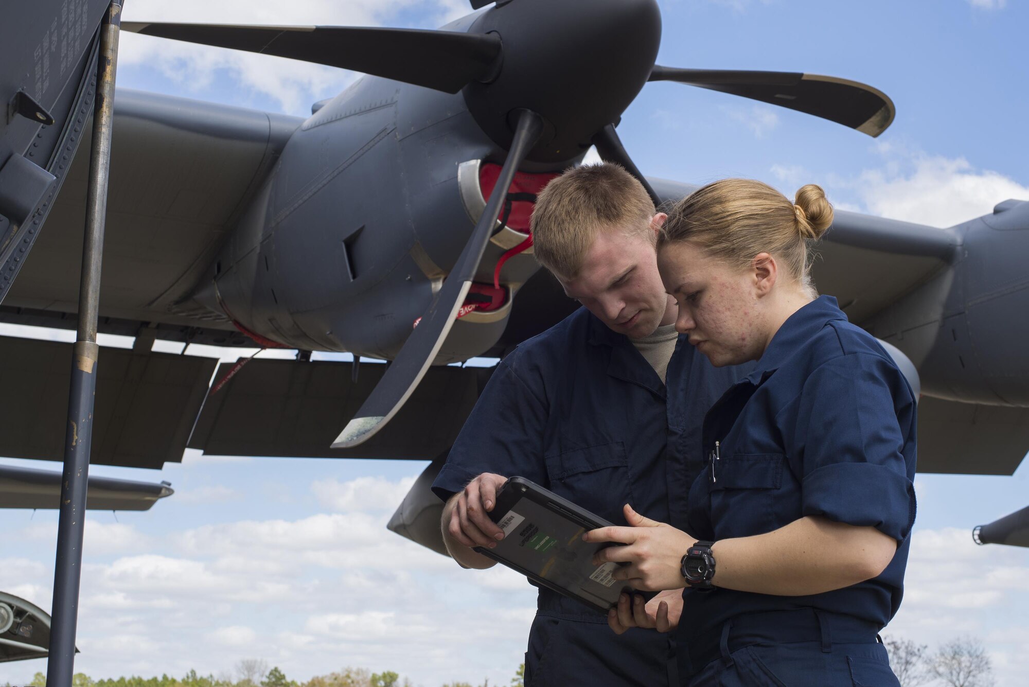 U.S. Air Force Senior Airman Brendan Stienbach, left, and Airman 1st Class Rachel Camp, 23d Equipment Maintenance Squadron repair and reclamation technicians, view training guidelines for an operational checkout of a HC-130J Combat King II , March 9, 2016, at Moody Air Force Base, Ga. Repair and reclamation Airmen inspect and check components for clearances, tolerances, proper installation and operation. (U.S. Air Force photo by Airman Daniel Snider/Released)