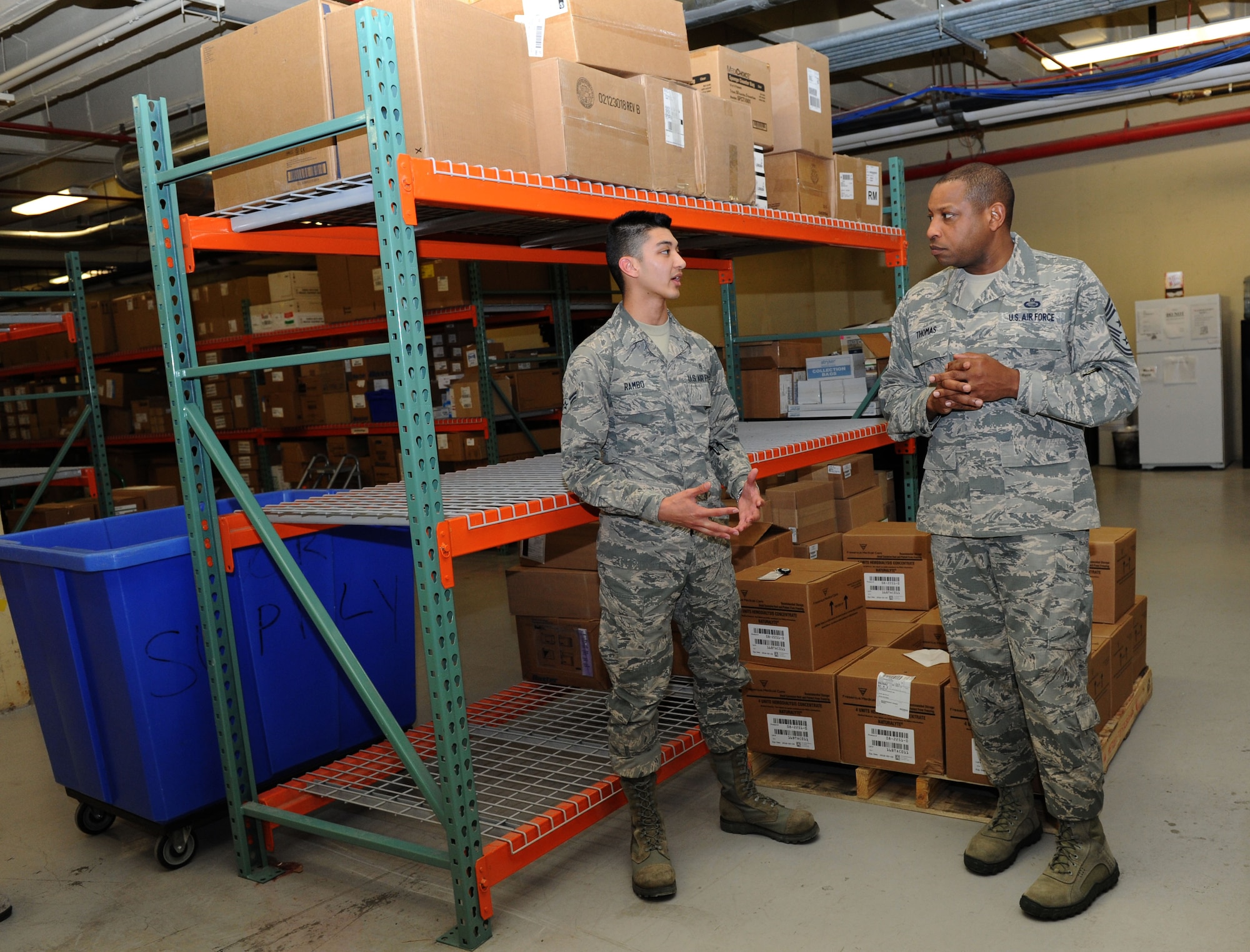 Airman 1st Class Jason Rambo, 81st Medical Support Squadron medical logistics technician, briefs Chief Master Sgt. Farrell Thomas, 2nd Air Force command chief, on medical logistics during an immersion tour at the Keesler Medical Center Mar.8, 2016, Keesler Air Force Base, Miss. Thomas visited the 81st Medical Group to become oriented with group missions, operations and personnel. (U.S. Air Force photo by Kemberly Groue)