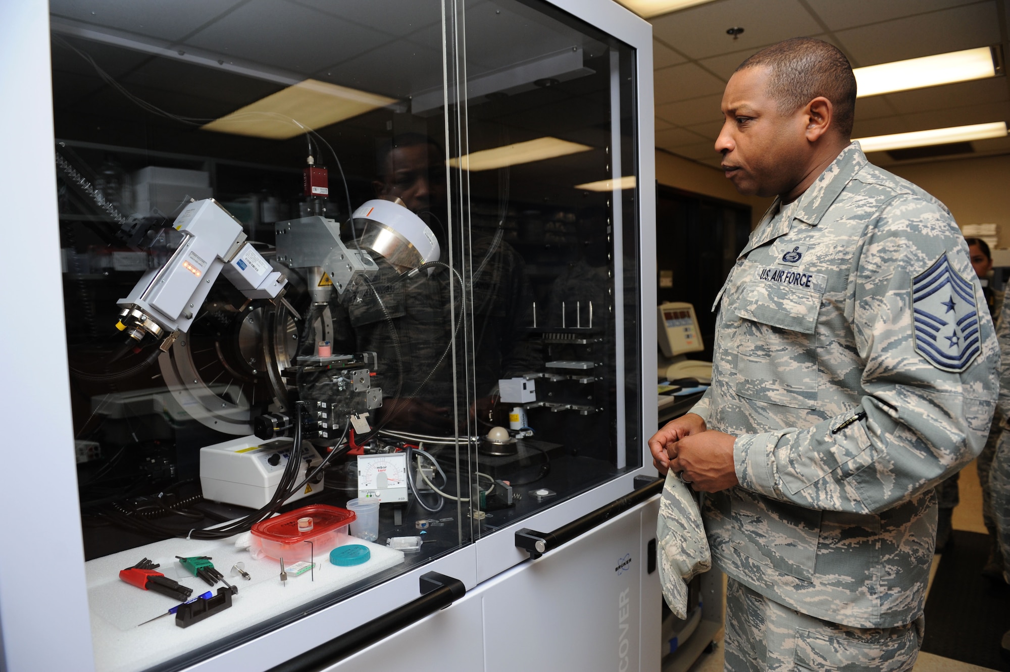 Chief Master Sgt. Farrell Thomas, 2nd Air Force command chief, views training equipment during an immersion tour at the clinical research lab Mar.8, 2016, Keesler Air Force Base, Miss. Thomas visited the 81st Medical Group to become oriented with group missions, operations and personnel. (U.S. Air Force photo by Kemberly Groue)

