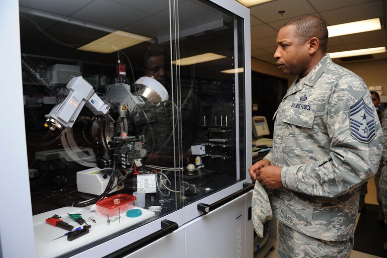 Chief Master Sgt. Farrell Thomas, 2nd Air Force command chief, views training equipment during an immersion tour at the clinical research lab Mar.8, 2016, Keesler Air Force Base, Miss. Thomas visited the 81st Medical Group to become oriented with group missions, operations and personnel. (U.S. Air Force photo by Kemberly Groue)

