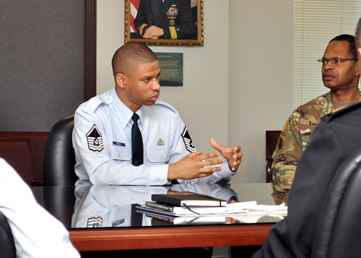 Air Force Master Sgt. Keith Grady, a noncommissioned officer assigned to DLA Energy through the Logistics Education Advancement Program, briefs Army Command Sgt. Maj. John Wayne Troxell, senior enlisted advisor to the Chairman of the Joint Chiefs of Staff, during a meeting at the McNamara Headquarters Complex in Fort Belvoir, Virginia, March 8.