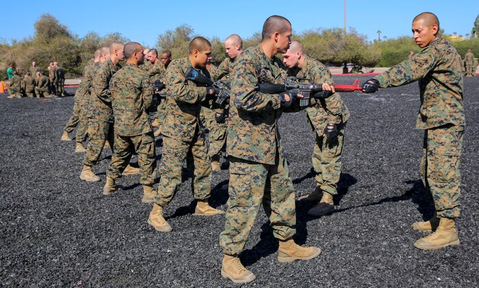 Recruits of Delta Company, 1st Recruit Training Battalion, conduct counters with rifles during a Marine Corps Martial Arts Program Test and Marine Corps Recruit Depot San Diego, March 9. In order to make the simulation feel more real, recruits partnered up with another recruit to conduct the techniques. Annually, more than 17,000 males recruited from the Western Recruiting Region are trained at MCRD San Diego. Delta Company is scheduled to graduate April 1.