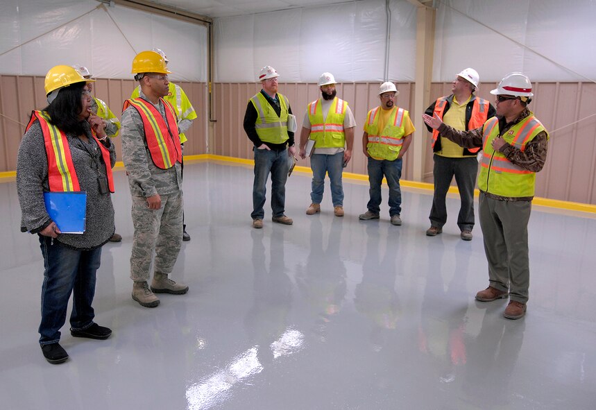 Louis Uptmor, U.S. Army Corps of Engineers Nebraska resident engineer, explains to members of the 55th Logistics Readiness Squadron the renovations made to building 543 during a walk-through inspection of the Disposition Services facility at Offutt Air Force Base, Neb.  March 9. The building was renovated as part of a $2.8 million project.