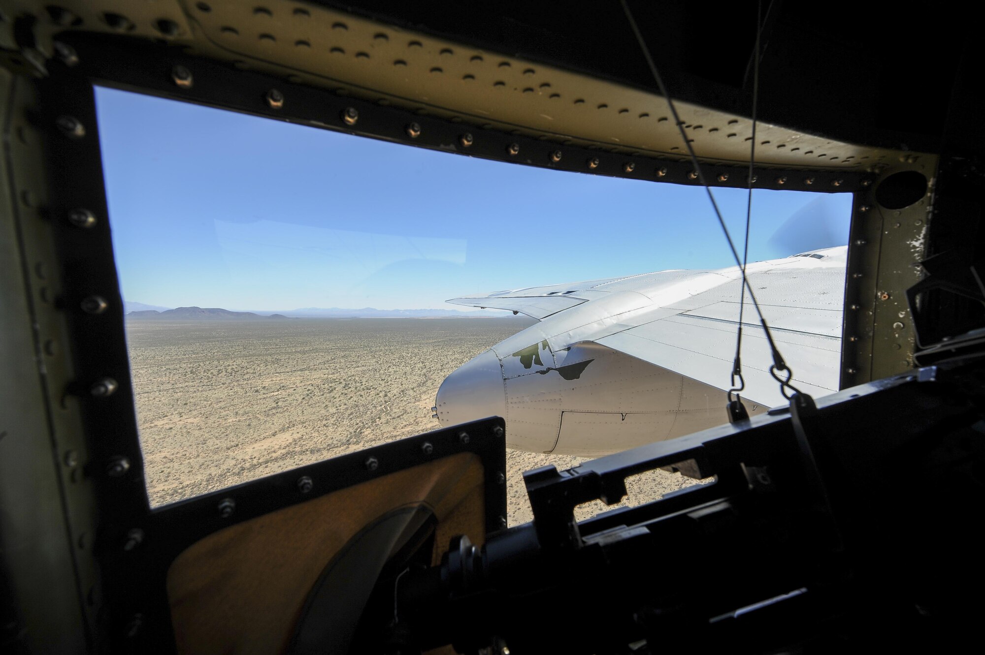 A North American B-25 Mitchell flown by the Disabled American Veterans flight team flies over Tucson, Ariz., March 10, 2016. The B-25 will be performing at the Thunder and Lightning over Arizona Open House, where the D-M Airmen show their appreciation to the local community for their support to the base. (U.S. Air Force photo by Staff Sgt. Angela Ruiz/Released)