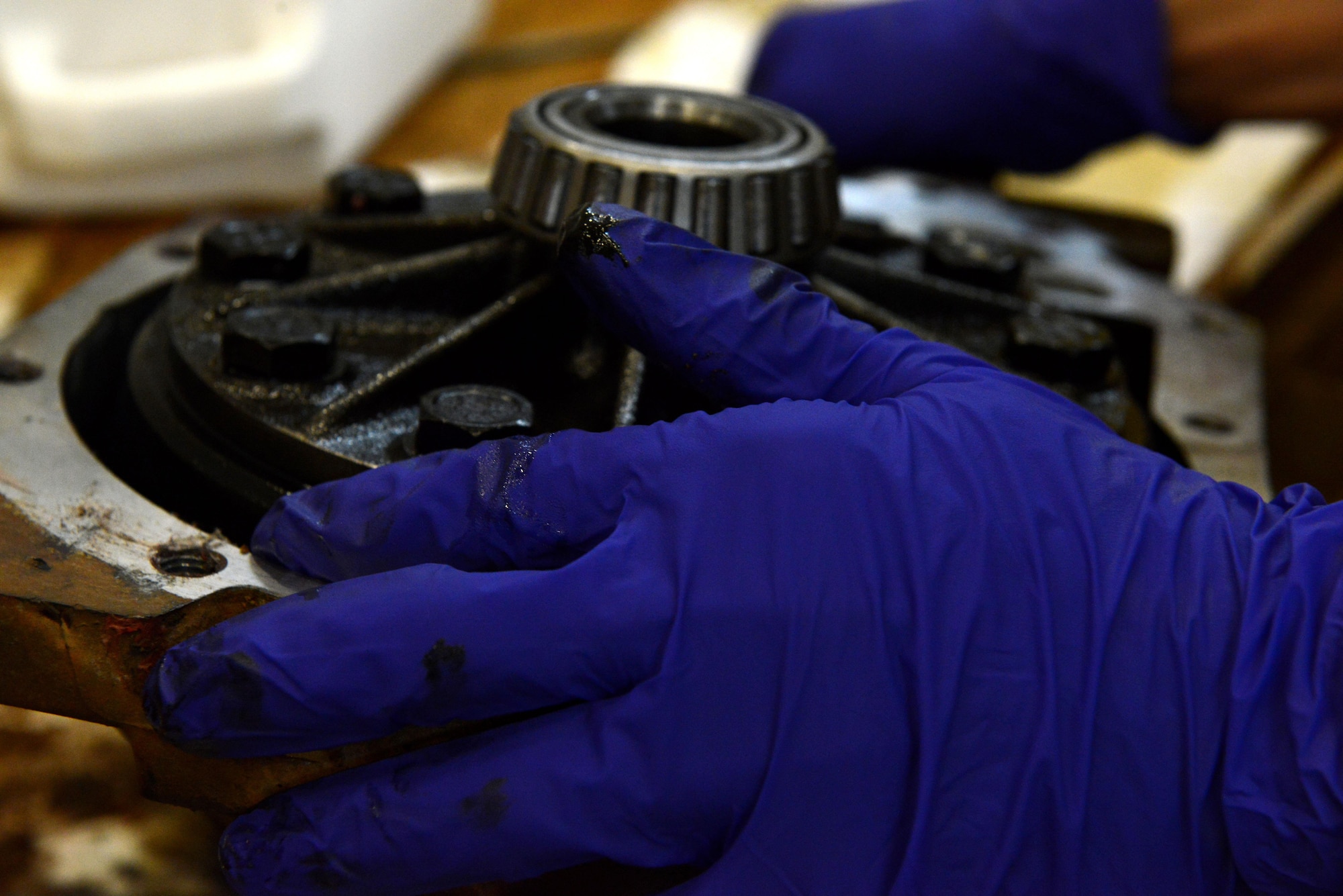 U.S. Air Force Senior Airman Ryan Marney, 20th Logistics Readiness Squadron vehicle maintenance flight vehicle maintenance journeyman, puts together a front differential at Shaw Air Force Base, S.C., March 9, 2016. The front differential enables four-wheel drive capabilities on some vehicles. (U.S. Air Force photo by Airman 1st Class Destinee Dougherty)