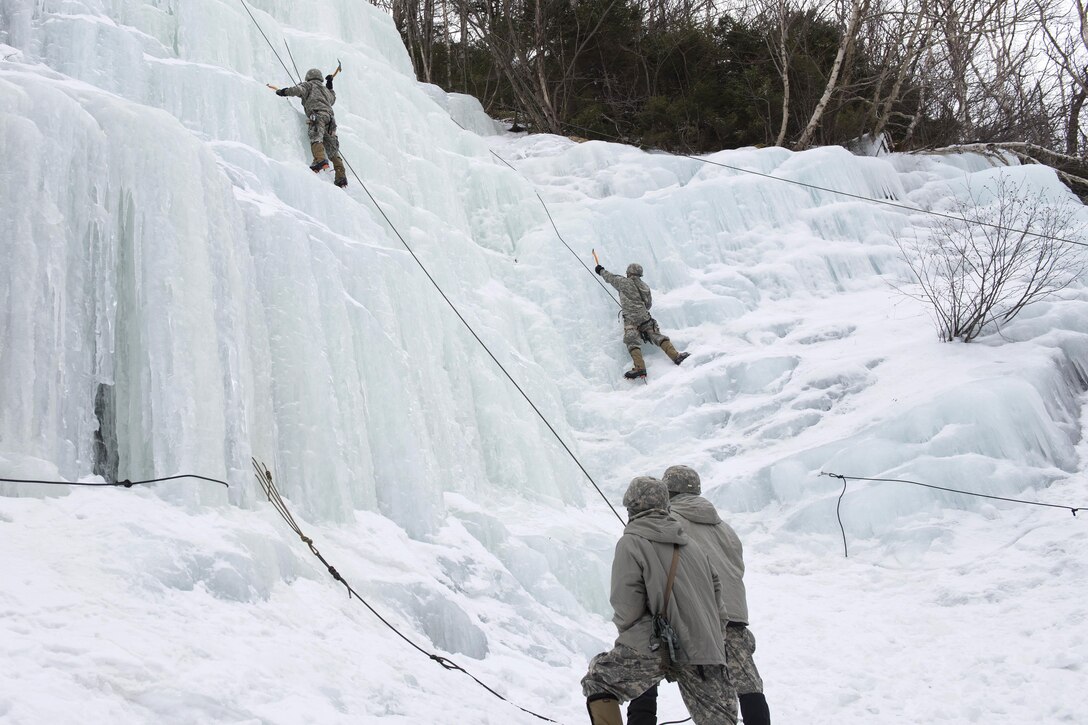 Soldiers climb an ice wall at Smugglers' Notch in Jeffersonville, Vt., March 5, 2016. Vermont Army National Guard photo by Staff Sgt. Nathan Rivard