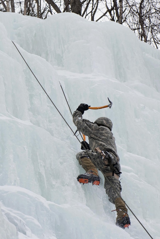 A soldier climbs an ice wall at Smugglers' Notch in Jeffersonville, Vt., March 5, 2016. Vermont Army National Guard photo by Staff Sgt. Nathan Rivard