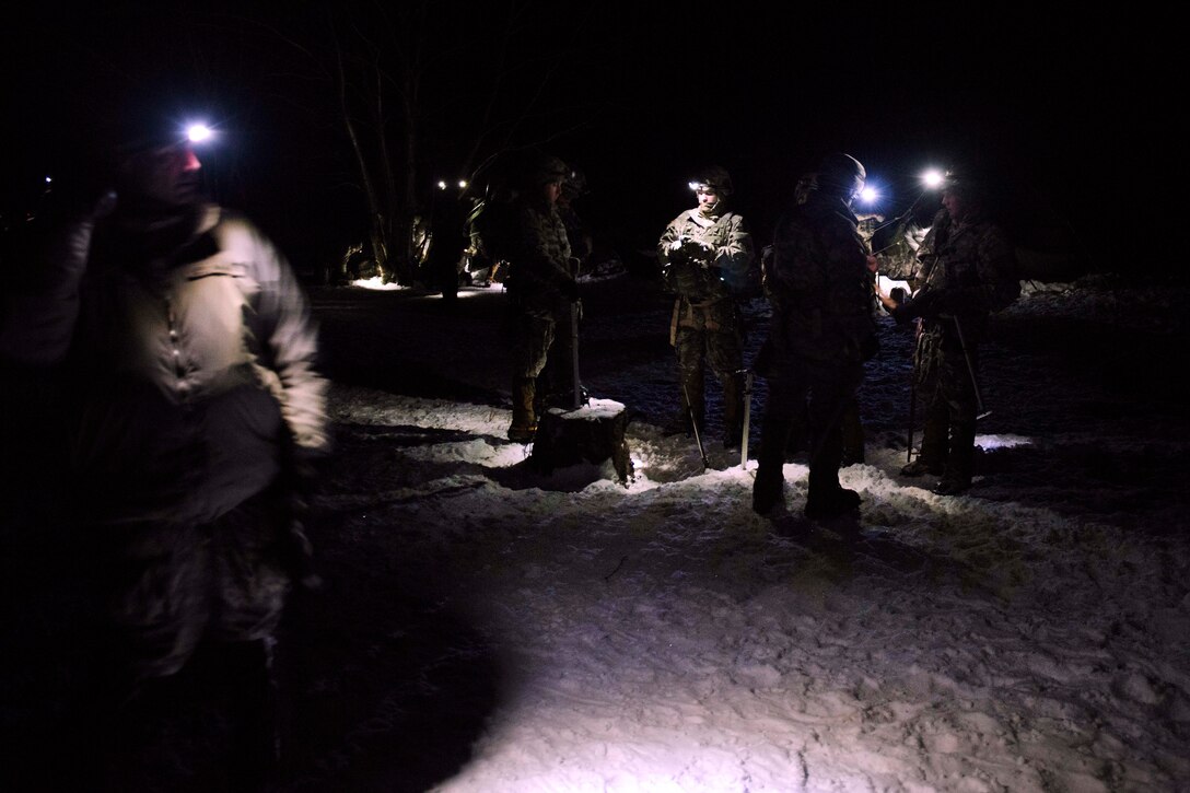 Soldiers prepare for night mountaineering training at Smugglers' Notch in Jeffersonville, Vt., March 5, 2016. Vermont Army National Guard photo by Staff Sgt. Nathan Rivard