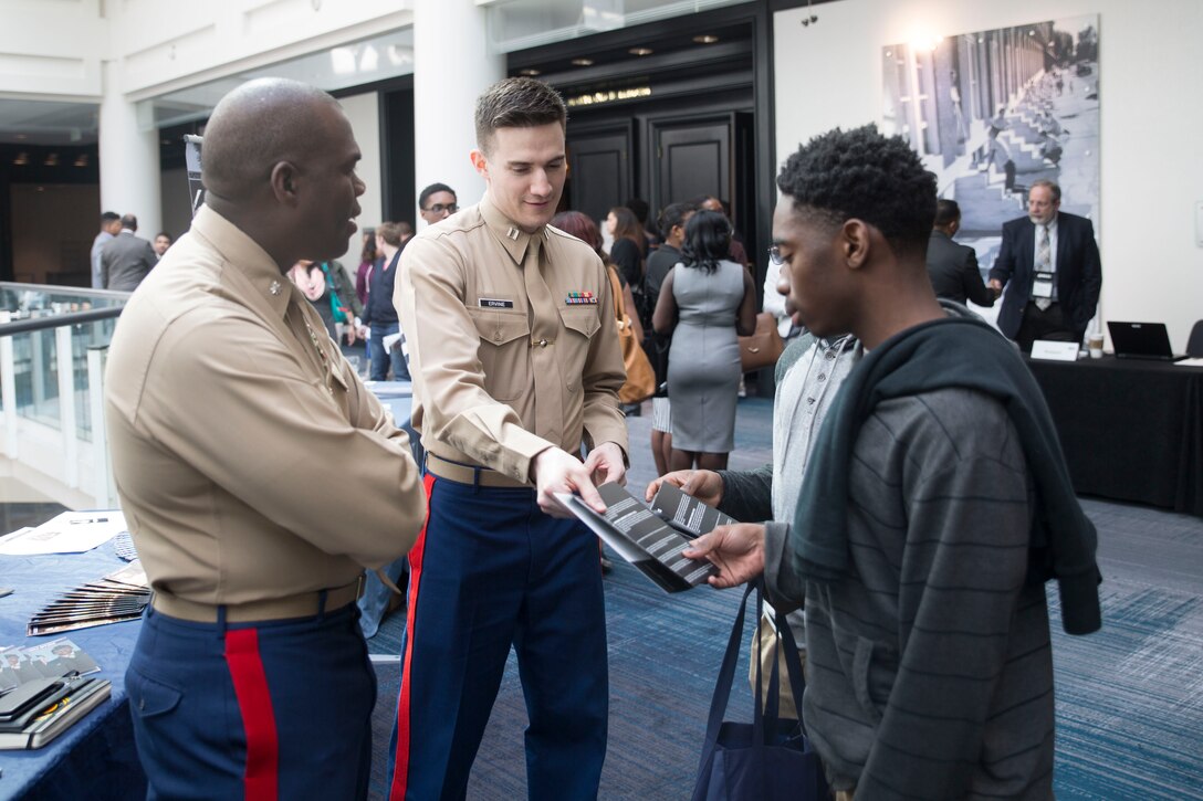 Lieutenant Col. Christopher Shaw (left) and Capt. Matthew Ervine speak with National Black Law Student Association members during the 2016 NBLSA Convention Career Fair at the Renaissance Hotel in Baltimore, Md., March 11, 2016. The NBLSA is a national organization, formed to articulate and promote the needs and goals of black law students and to effectuate change in the legal community. Shaw currently serves as the legal advisor to the Secretary of the Navy at the Pentagon in Washington D.C. Ervine currently serves as a Diversity Officer at Marine Corps Recruiting Command in Quantico, Va.
