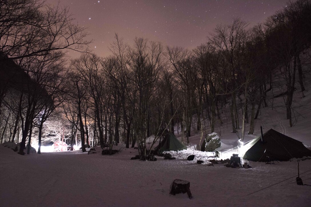 Soldiers bivouac after a day of mountaineering training at Smugglers' Notch in Jeffersonville, Vt., March 5, 2016. Vermont Army National Guard photo by Staff Sgt. Nathan Rivard
