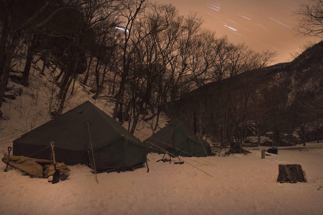 Soldiers bivouac after a day of mountaineering training at Smugglers' Notch in Jeffersonville, Vt., March 5, 2016. Vermont Army National Guard photo by Staff Sgt. Nathan Rivard