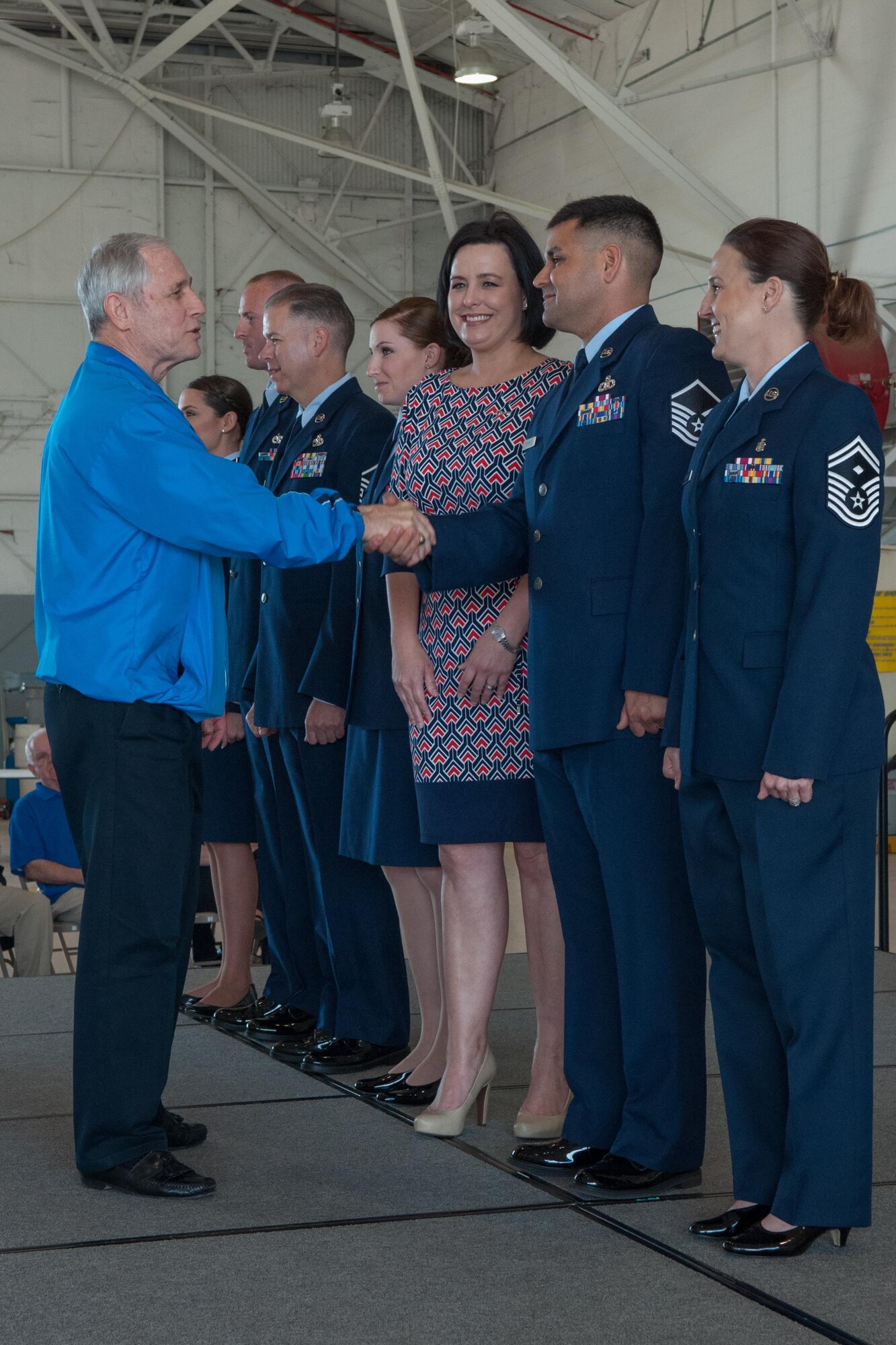U.S. Air Force Master Sgt. Curtis Downey is congratulated by Retired Chief Master Sgt. Jack Skaggs, who represents the Air Force Association, on March 6, 2016. Downey was awarded the 2015 Senior Noncommissioned Officer of the Year for the 307th Bomb Wing. (U.S. Air Force photo by Master Sgt. Dachelle Melville/Released)