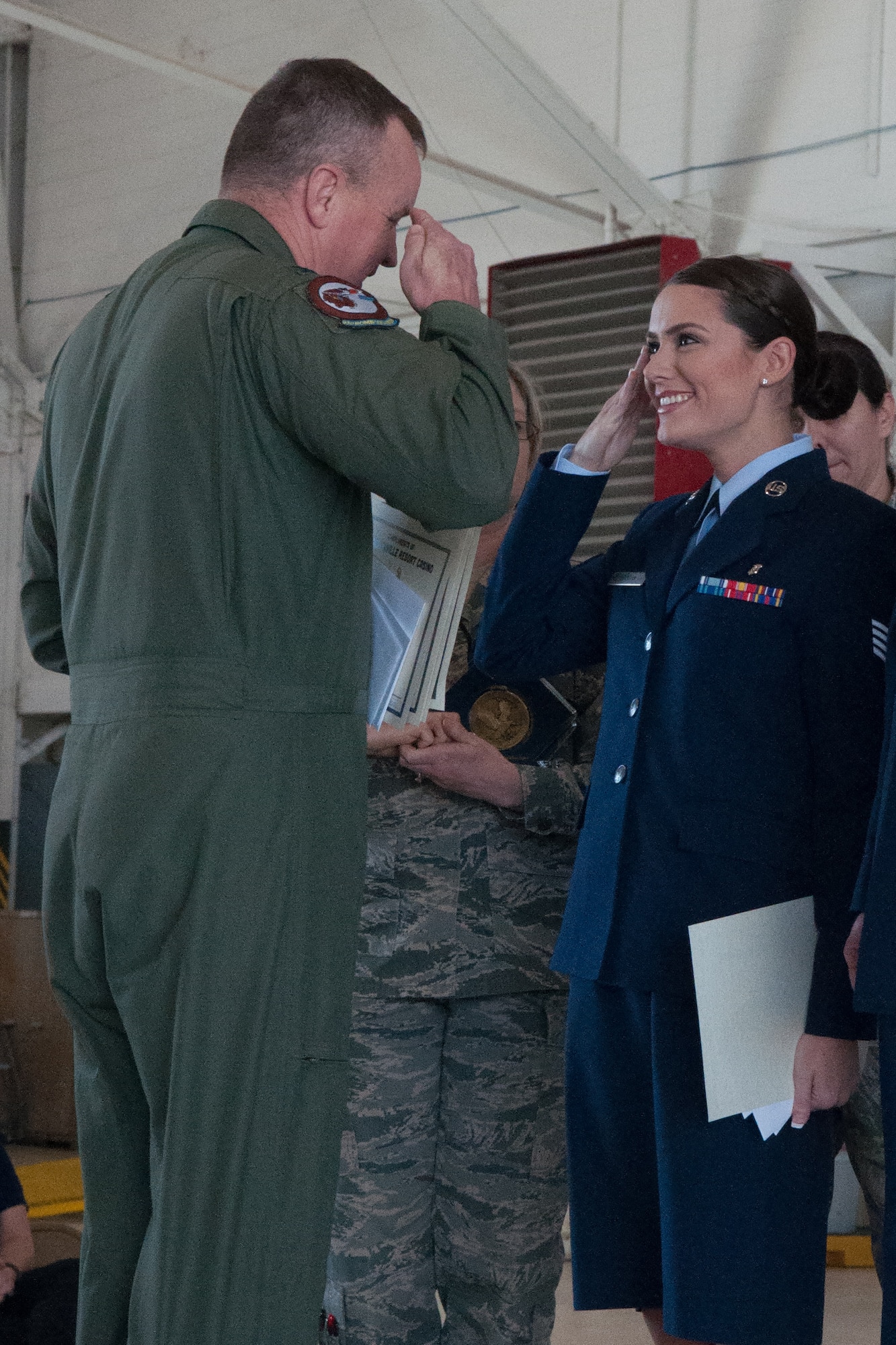 U.S. Air Force Staff Sgt. Danielle Vaughn, 307th Medical Squadron, salutes Col. Bruce Cox, commander of the 307th Bomb Wing, after receiving awards for being chosen as the Airman of the Quarter for the period of October to December 2015. Vaughn was recognized at a wing commander’s call on March 6, 2016 on Barksdale Air Force Base, La. (U.S. Air Force photo by Master Sgt. Dachelle Melville/Released)