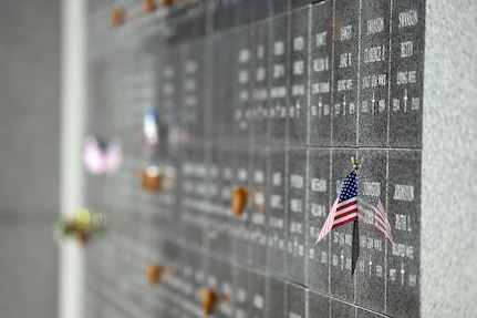 An American Flag lies placed in a veterans’ memorial wall at the Memory Gardens cemetery in Arlington Heights, Ill., March 4, 2016. A memorial service for Army Spc. Adriana Salem was held there, coordinated by her mother, for the 11th anniversary of Salem’s death. Attendees included Congresswoman Tammy Duckworth, former Illinois governor Patrick Quinn, Illinois Patriot Guard, and Army Reserve soldiers from the 85th Support Command and 85th Army Band. Salem, assigned to the 3rd Infantry Division, was killed in Remagen, Iraq on March 4, 2005.
(U.S. Army photo by Mr. Anthony L. Taylor/Released)

