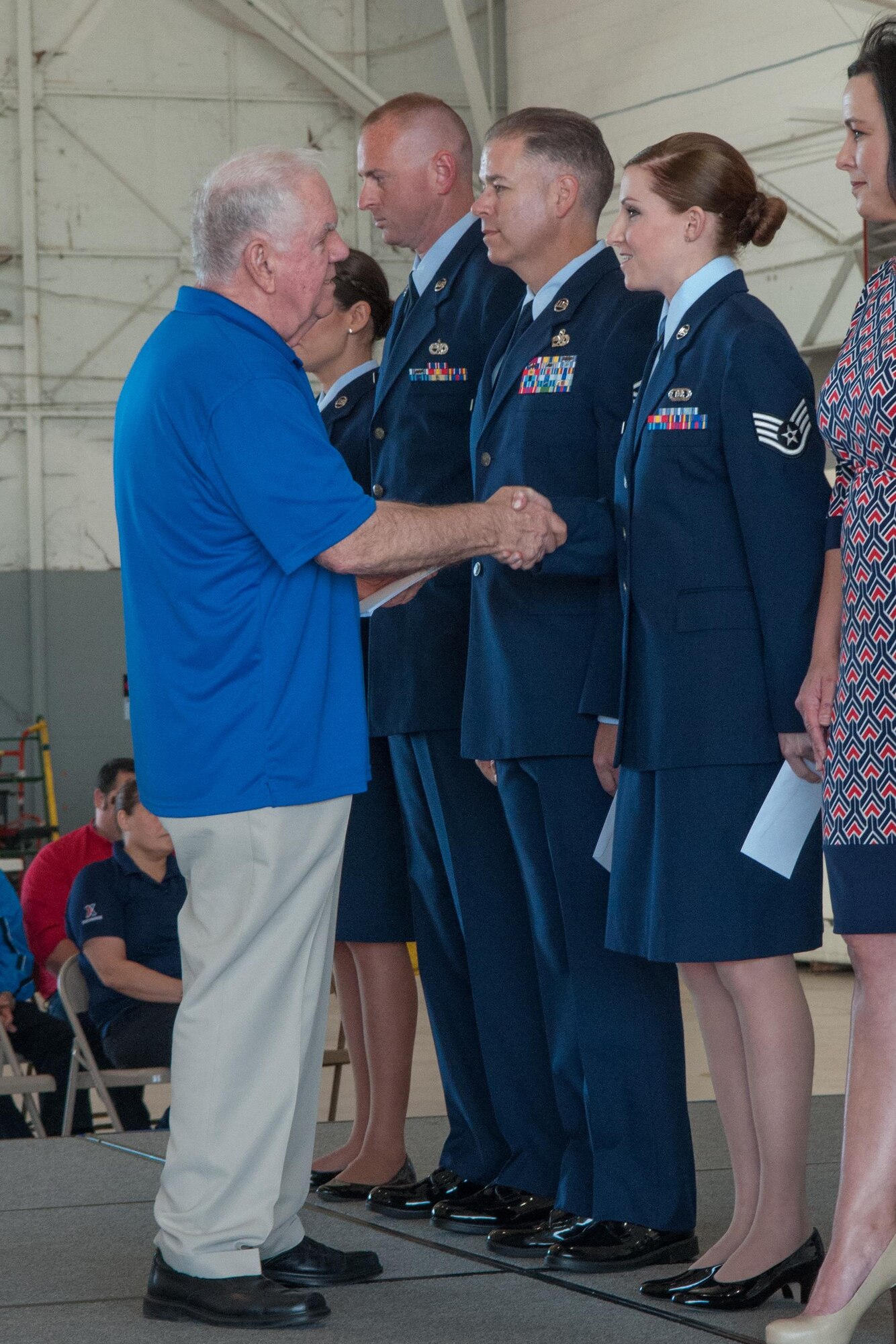 Mr. Don Reed from GEICO congratulates Staff Sgt. Megan Kay, of the 307th Operations Support Squadron, for being awarded the 2015 Airman of the Year for the 307th Bomb Wing on March 6, 2016 on Barksdale Air Force Base, La. Kay was recognized during the Wing Commander’s Call. (U.S. Air Force photo by Master Sgt. Dachelle Melville/Released)