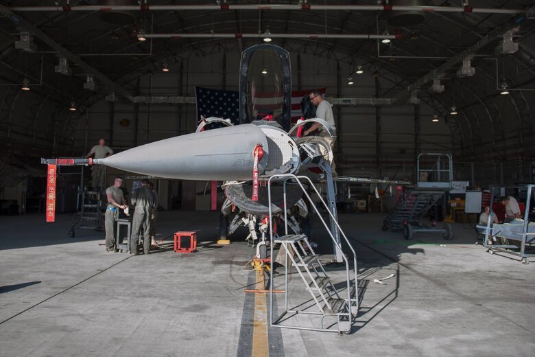 Members of the 455th Expeditionary Aircraft Maintenance Squadron phase inspection team and fabrication flight work on an F-16 at Bagram Airfield, Afghanistan, Feb. 24. The 455th EAMXS ensures aircraft are prepared for flight and return them to a mission-ready state once they land. (U.S. Air Force photo/Tech. Sgt. Robert Cloys)
