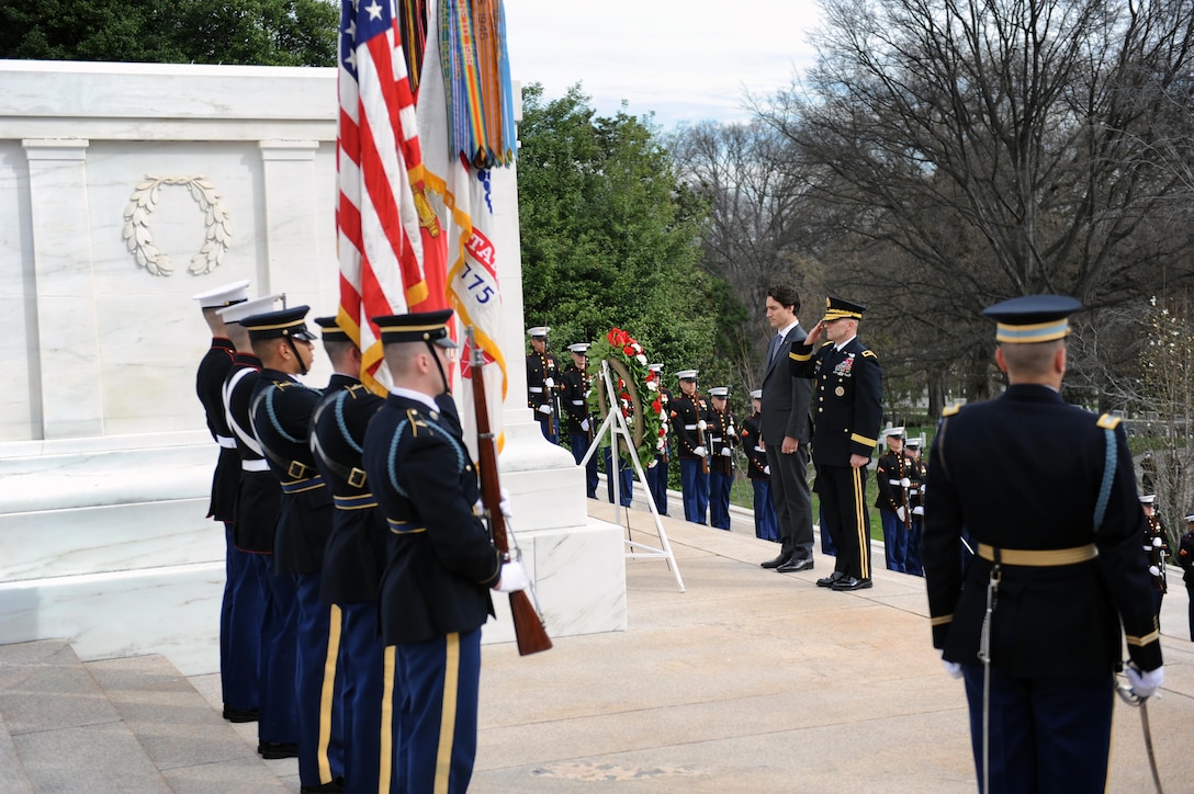 Canadian Prime Minister Justin Trudeau, center left, lays a wreath at the Tomb of the Unknown Soldier as Army Maj. Gen. Bradley A. Becker looks on at Arlington National Cemetery in Arlington, Va., March 11, 2016. Becker is the commanding general of Joint Force Headquarters National Capitol Region and the Army Military District of Washington. DoD photo by Marvin Lynchard