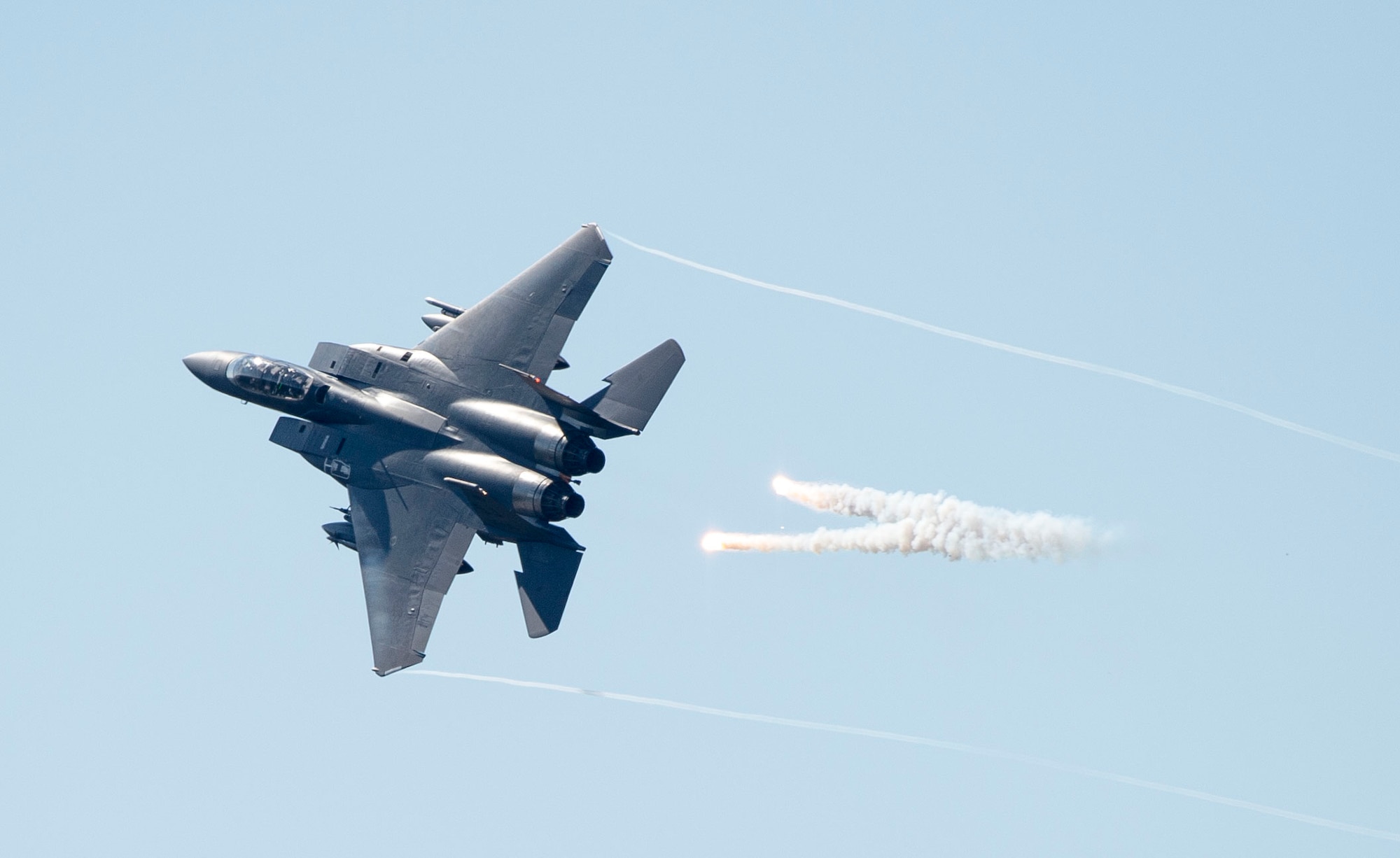 An F-15E Strike Eagle releases flares over Grand Bay Bombing and Gunnery Range at Moody Air Force Base, Ga., Feb. 18, 2016. Multiple U.S. Air Force aircraft within Air Combat Command conducted joint combat rescue and aerial training that showcased the aircrafts tactical air and ground maneuvers, as well as its weapons capabilities. (U.S. Air Force photo by Staff Sgt. Brian J. Valencia/Released)