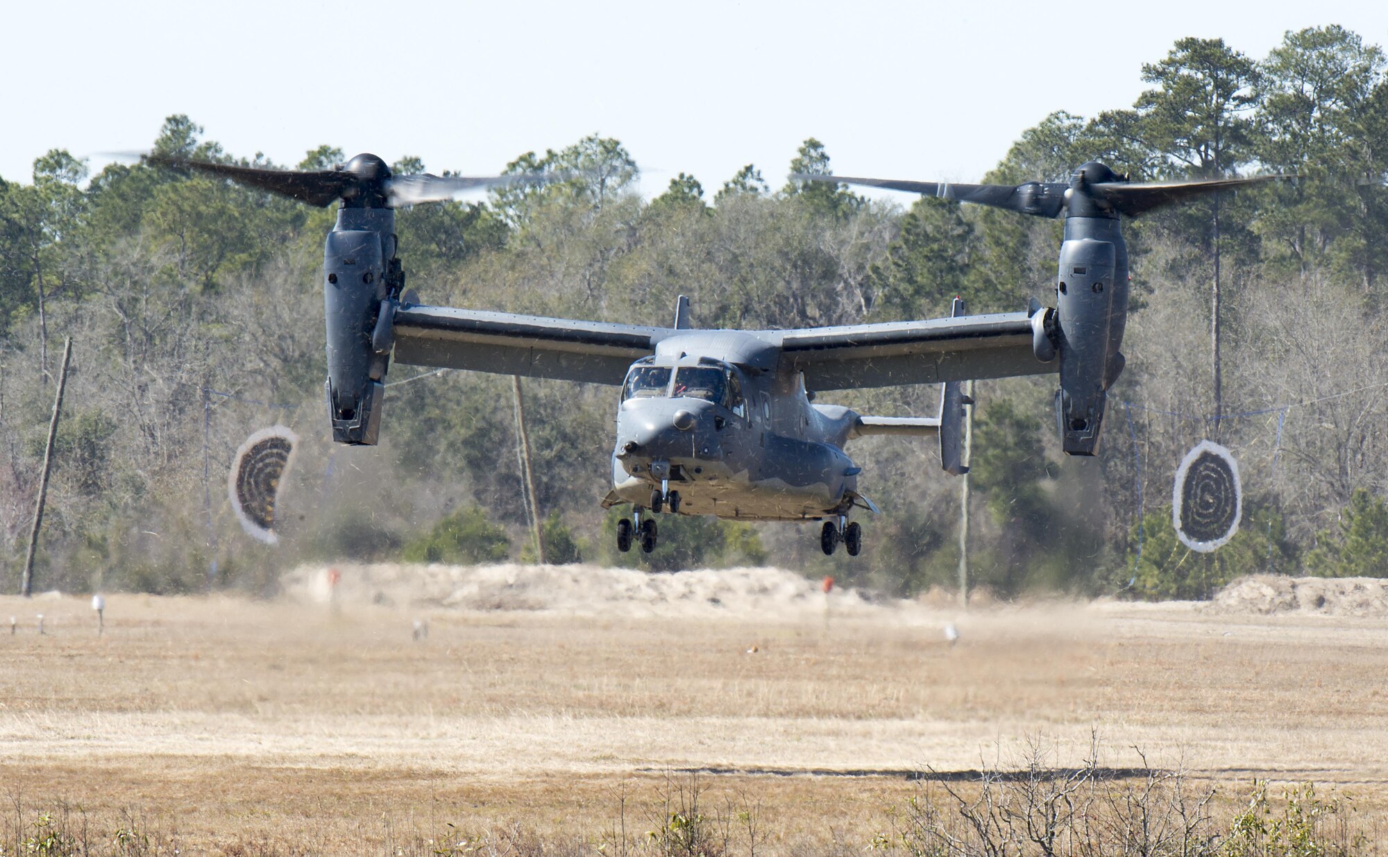 A CV-22 Osprey comes in for a landing on Grand Bay Bombing and Gunnery Range at Moody Air Force Base, Ga., Feb. 18, 2016. Multiple U.S. Air Force aircraft within Air Combat Command conducted joint combat rescue and aerial training that showcased the aircrafts tactical air and ground maneuvers, as well as its weapons capabilities. (U.S. Air Force photo by Staff Sgt. Brian J. Valencia/Released)