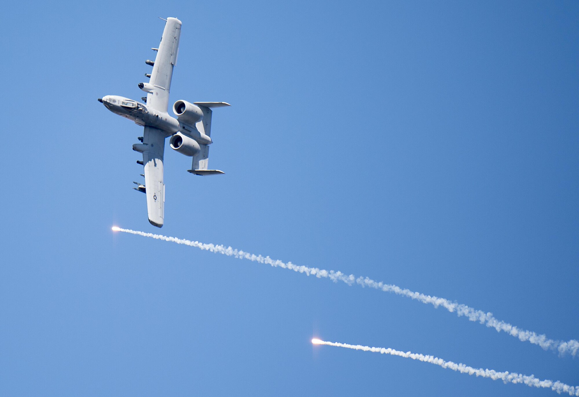 An A-10 Thunderbolt II releases flares over Grand Bay Bombing and Gunnery Range at Moody Air Force Base, Ga., Feb. 18, 2016. Multiple U.S. Air Force aircraft within Air Combat Command conducted joint combat rescue and aerial training that showcased the aircrafts tactical air and ground maneuvers, as well as its weapons capabilities. (U.S. Air Force photo by Staff Sgt. Brian J. Valencia/Released)
