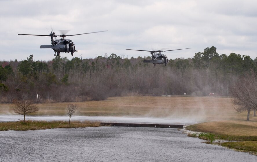 Two HH-60 Pave Hawks land at Moody Air Force Base, Ga., Mar. 4, 2016. Multiple U.S. Air Force aircraft within Air Combat Command conducted joint aerial training that showcased the aircrafts tactical air and ground maneuvers, as well as its weapons capabilities. (U.S. Air Force photo by Staff Sgt. Brian J. Valencia/Released)