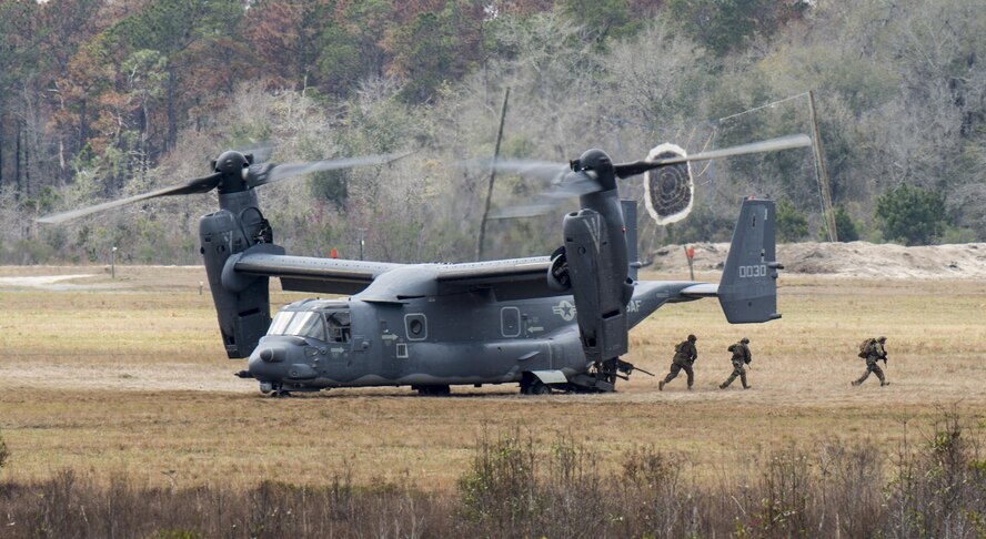 A CV-22 Osprey deploys a tactical air control party onto the ground of Grand Bay Bombing and Gunnery Range at Moody Air Force Base, Ga., Mar. 4, 2016. Multiple U.S. Air Force aircraft within Air Combat Command conducted joint combat rescue and aerial training that showcased the aircrafts tactical air and ground maneuvers, as well as its weapons capabilities. (U.S. Air Force photo by Staff Sgt. Brian J. Valencia/Released)