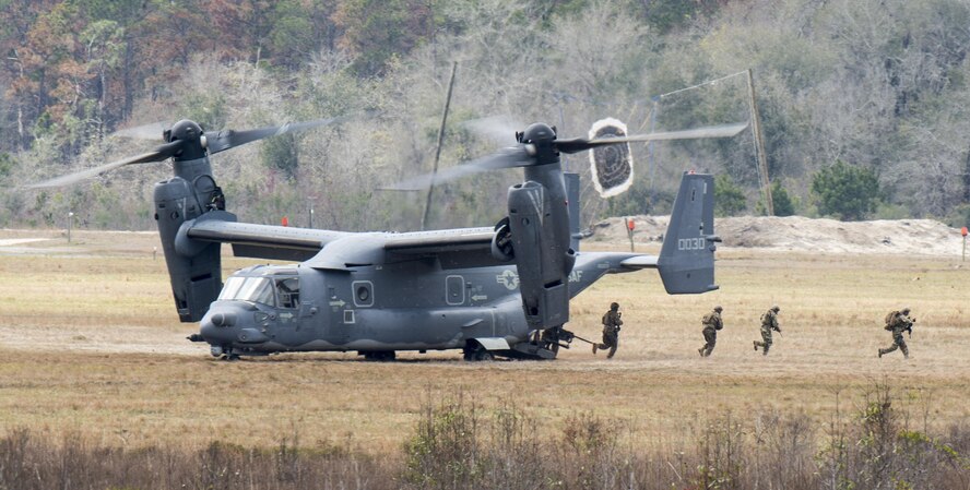 A CV-22 Osprey deploys a tactical air control party onto the ground of Grand Bay Bombing and Gunnery Range at Moody Air Force Base, Ga., Mar. 4, 2016. Multiple U.S. Air Force aircraft within Air Combat Command conducted joint combat rescue and aerial training that showcased the aircrafts tactical air and ground maneuvers, as well as its weapons capabilities. (U.S. Air Force photo by Staff Sgt. Brian J. Valencia/Released)