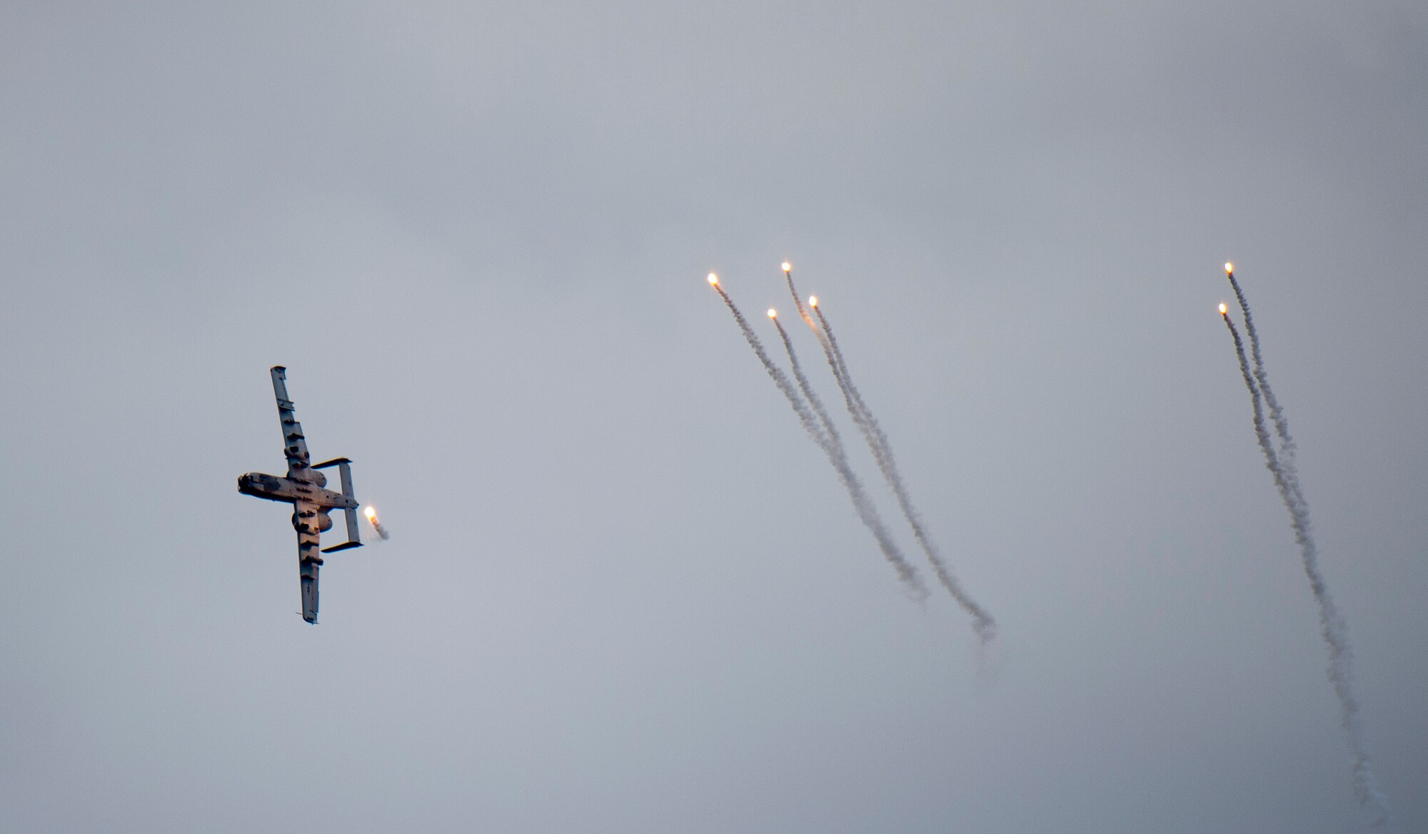 An A-10 Thunderbolt II releases flares over Grand Bay Bombing and Gunnery Range at Moody Air Force Base, Ga., Mar. 4, 2016. Multiple U.S. Air Force aircraft within Air Combat Command conducted joint aerial training that showcased the aircrafts tactical air and ground maneuvers, as well as its weapons capabilities. (U.S. Air Force photo by Staff Sgt. Brian J. Valencia/Released)