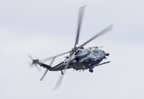An HH-60 Pave Hawk flies over Grand Bay Bombing and Gunnery Range at Moody Air Force Base, Ga., Mar. 4, 2016. Multiple U.S. Air Force aircraft within Air Combat Command conducted joint aerial training that showcased the aircrafts tactical air and ground maneuvers, as well as its weapons capabilities. (U.S. Air Force photo by Staff Sgt. Brian J. Valencia/Released)
