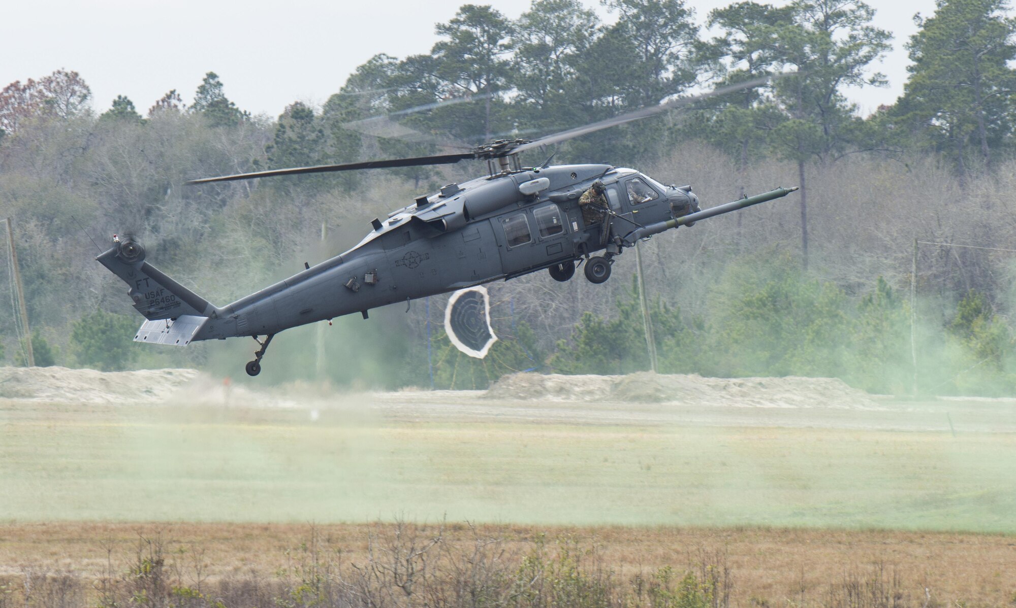 An HH-60 Pave Hawk lands for a simulated rescue on Grand Bay Bombing and Gunnery Range at Moody Air Force Base, Ga., Feb. 18, 2016. Multiple U.S. Air Force aircraft within Air Combat Command conducted joint aerial training that showcased the aircrafts tactical air and ground maneuvers, as well as its weapons capabilities. (U.S. Air Force photo by Staff Sgt. Brian J. Valencia/Released)