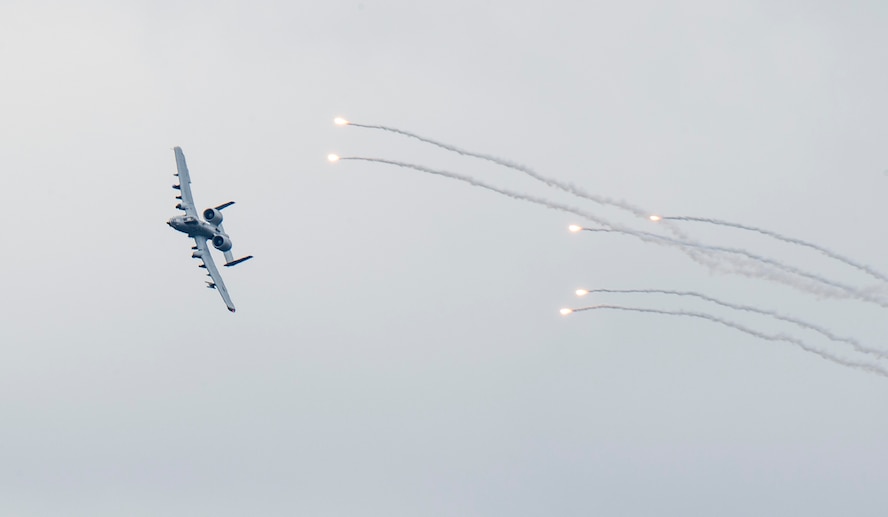 An A-10 Thunderbolt II releases flares over Grand Bay Bombing and Gunnery Range at Moody Air Force Base, Ga., Feb. 18, 2016. Multiple U.S. Air Force aircraft within Air Combat Command conducted joint aerial training that showcased the aircrafts tactical air and ground maneuvers, as well as its weapons capabilities. (U.S. Air Force photo by Staff Sgt. Brian J. Valencia/Released)