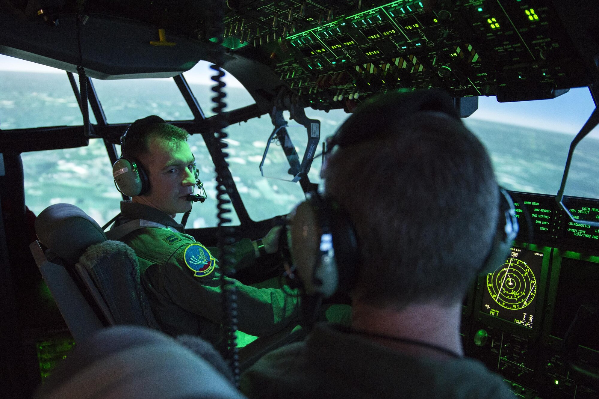 Two U.S. Air Force pilots practice flying in an HC-130J Combat King II simulator, March 10, 2015, at Moody Air Force Base, Ga. Simulator operators can input external factors for scenarios that affect the aircraft in various ways without risking the aircrew’s safety. (U.S. Air Force photo by Airman 1st Class Kathleen D. Bryant/Released)