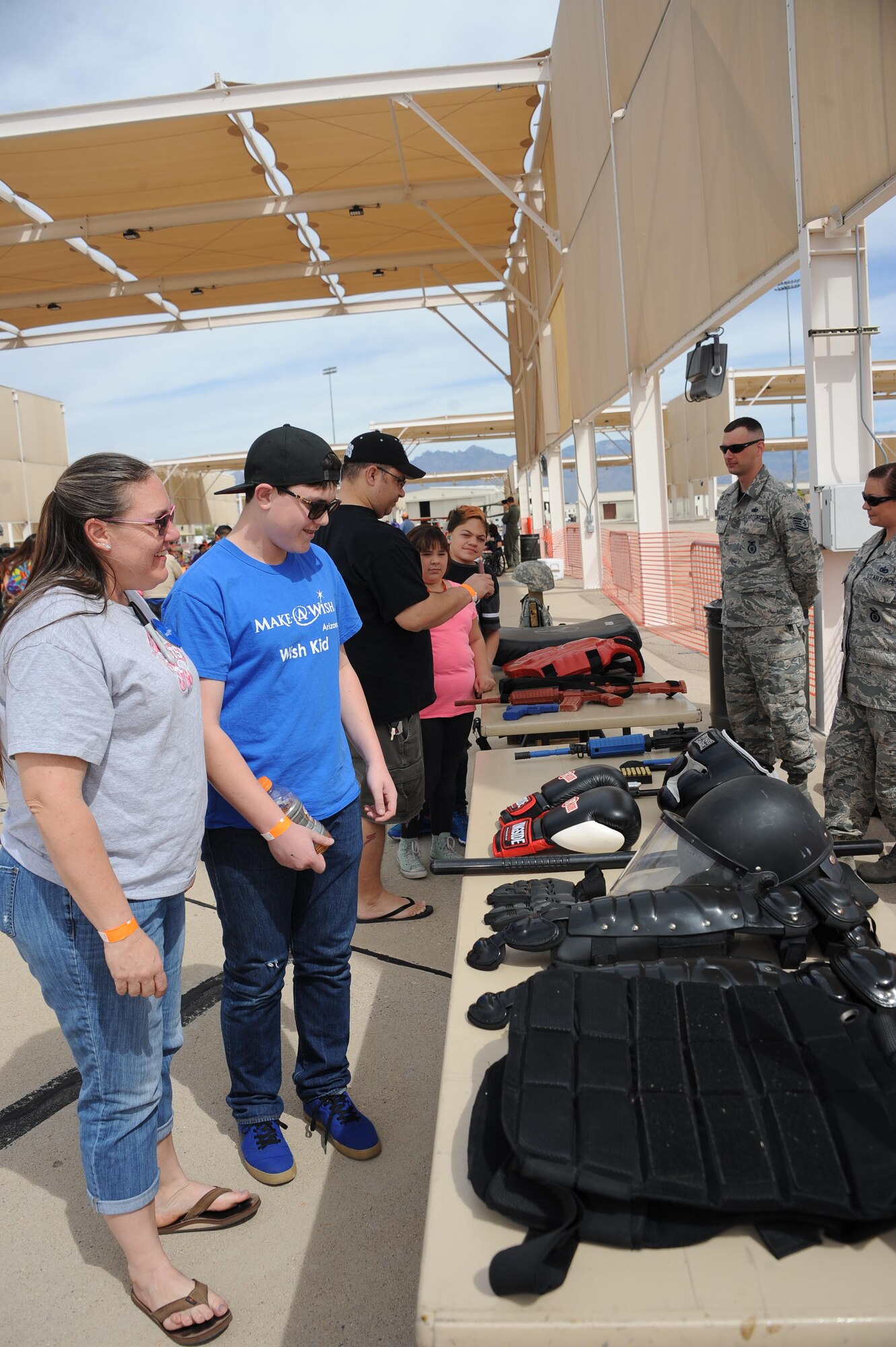 U.S. Air Force 355th Security Forces Squadron displays protective equipment and protective gear during Hero’s Day at Davis-Monthan Air Force Base, Ariz., March 11, 2016. Hero's Day in conjunction with Thunder and Lightning over Arizona Open House was a special VIP day that was created for people with medical illnesses, disabilities, or severe handicaps.  (U.S. Air Force photo by Airmen 1st Class Ashley N. Steffen/Releasd)