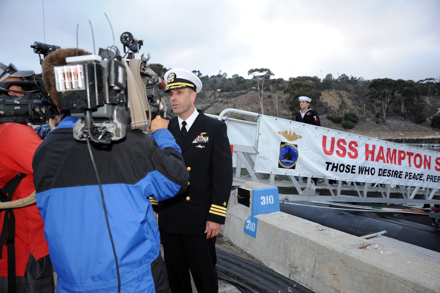 SAN DIEGO (December 18, 2013)  Cdr. Lincoln Reifsteck, commanding officer of the Los Angeles-class attack submarine USS Hampton (SSN 767) answers questions during an interview with local media following a six-month deployment to the western Pacific region. U.S. Navy photo by Mass Communication Specialist 2nd Class Kyle Carlstrom (Released)