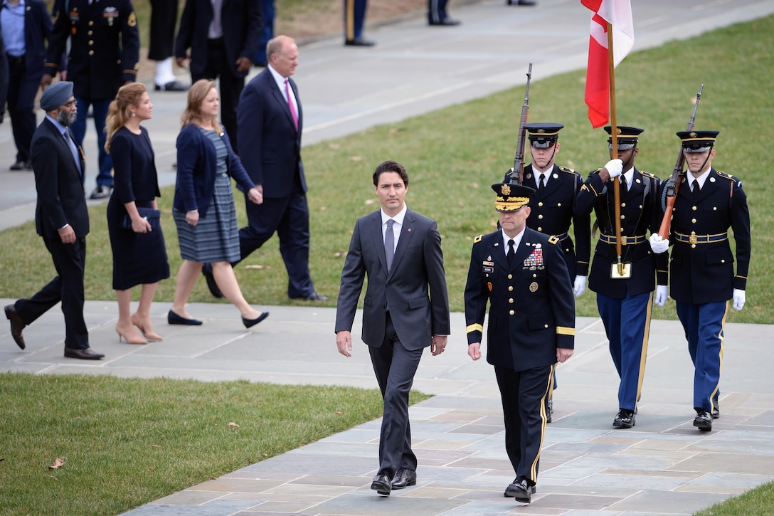 Canadian Prime Minister Justin Trudeau, center, and Army Maj. Gen. Bradley A. Becker approach the Tomb of the Unknown Soldier at Arlington National Cemetery in Arlington, Va., March 11, 2016. DoD photo by Marvin Lynchard